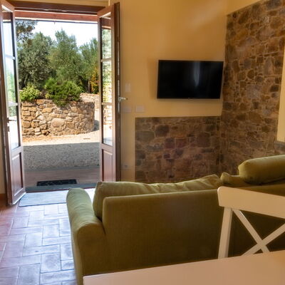 Marina's Lodge: Wall, Furniture, Flooring, Interior Design, Floor, Table, Room, Chair, Living Room, Ceiling