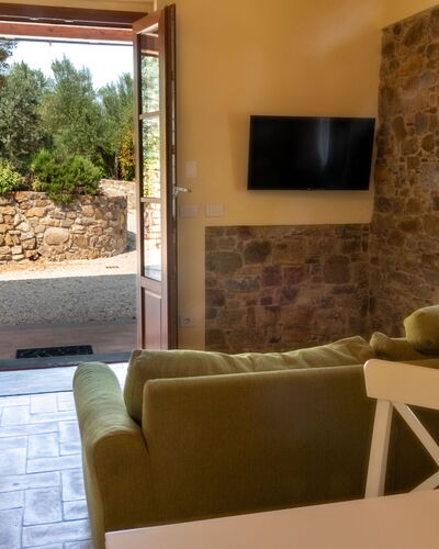 Marina's Lodge: Wall, Furniture, Flooring, Interior Design, Floor, Table, Room, Chair, Living Room, Ceiling