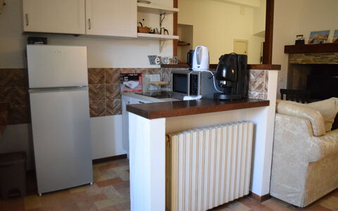 Appartamento la Fontana, Assisi: Furniture, Flooring, Wood, Interior Design, Floor, Kitchen Appliance, Room, Countertop, Major Appliance, Kitchen