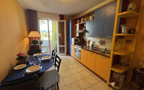 Liz: Flooring, Floor, Interior Design, Furniture, Apartment, Kitchen, Room, Major Appliance, Chair, Countertop