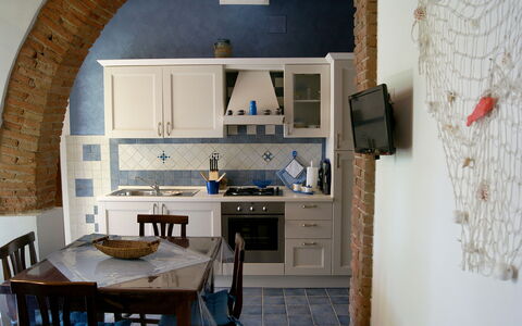 Appartamento Lavanda Seaside and Pool: Furniture, Interior Design, Wall, Flooring, Wood, Kitchen, Floor, Room, Kitchen & Dining Room Table, Chair