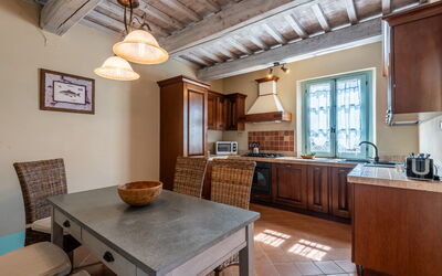 Appartamento Olivo: Furniture, Interior Design, Kitchen, Countertop, Cabinetry, Flooring, Wood, Ceiling, Floor, Room