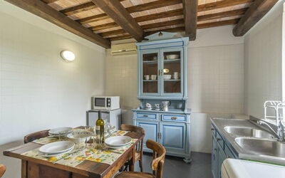 Villa: Furniture, Interior Design, Wood, Ceiling, Flooring, Countertop, Cabinetry, Kitchen, Room, Floor