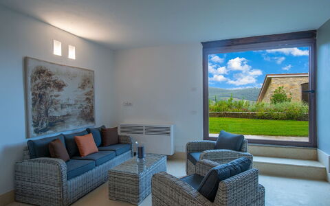 Villa Marinella: Furniture, Flooring, Chair, Couch, Coffee Table, Hardwood, Living Room, Picture Frame, Armrest