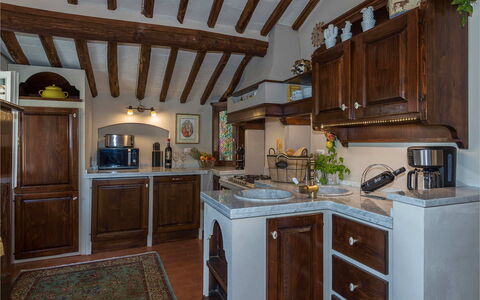 Villa Vorno: Kitchen, Furniture, Cabinetry, Interior Design, Countertop, Wood, Kitchen Appliance, Flooring, Cupboard, Lighting
