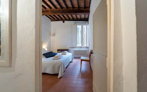 Le Loggine del Pignatello Apartment, Siena City: Wall, Wood, Ceiling, Flooring, Bedroom, Interior Design, Floor, Bed Sheet, Room, Bed