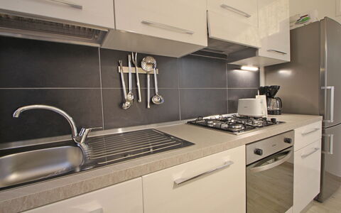 Il Centro: Kitchen, Kitchen Appliance, Countertop, Major Appliance, Kitchen Stove, Cabinetry, Kitchen Sink, Stove, Gas Stove, Home Appliance