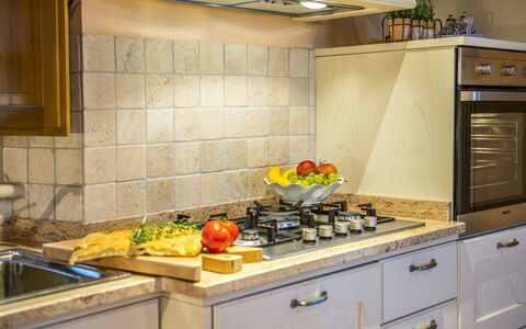 Casa Elia 6: Kitchen, Countertop, Kitchen Appliance, Cabinetry, Major Appliance, Kitchen Stove, Interior Design, Stove, Wood, Gas Stove