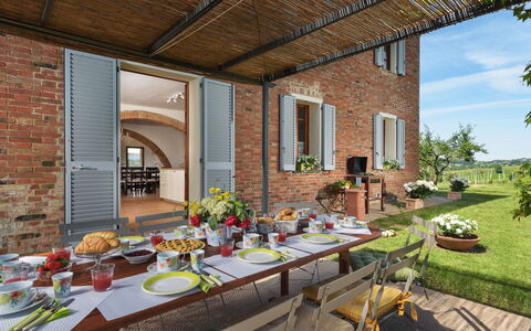 Poggio Vistabella 10: Furniture, Table, Kitchen & Dining Room Table, Chair, Brick, Outdoor Table, Outdoor Furniture, Dining Room, Tablecloth, Houseplant
