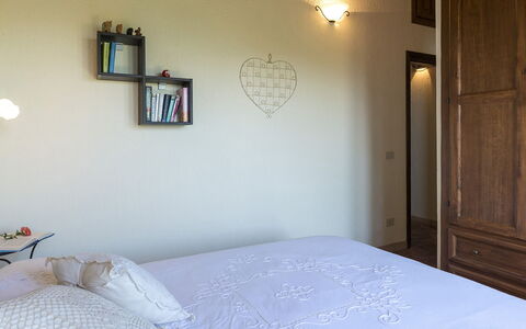 Casale al Doglio 6+1: Furniture, Bed, Bedroom, Wall, Interior Design, Bedding, Wood, Bed Sheet, Room, Lighting