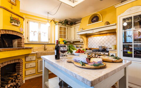 Villa Luigina 8: Furniture, Interior Design, Kitchen, Flooring, Countertop, Home, Lighting, Cabinetry, Floor, Ceiling