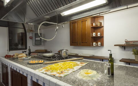 Villa Angelini 14+7: Kitchen, Countertop, Interior Design, Lighting, Flooring, Ceiling, Light Fixture, Room, Cabinetry, Kitchen Stove
