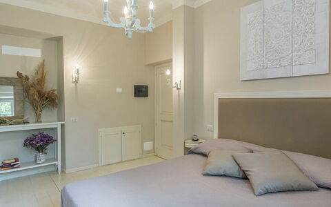 Villa la Corte 6: Furniture, Interior Design, Wall, Floor, Flooring, Wood, Room, Ceiling, Bed, Bedroom