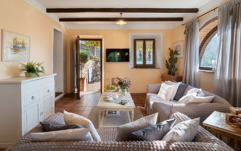 Villa Beltramonto 14: Furniture, Interior Design, Couch, Flooring, Wall, Floor, Room, Table, Wood, Living Room