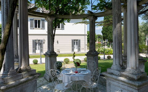 Villa Irma 10: Column, Porch, Estate, Molding, Garden, Flowerpot, Shade, Mansion, Yard, Landscaping
