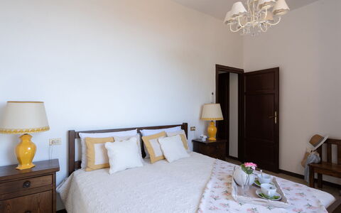 Villa ai Venti 8: Bed, Furniture, Interior Design, Bedroom, Bed Sheet, Bedding, Wood, Floor, Room, Flooring