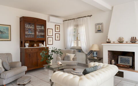 Villa Perelle 8: Furniture, Interior Design, Couch, Flooring, Wood, Living Room, Room, Floor, Lighting, Table