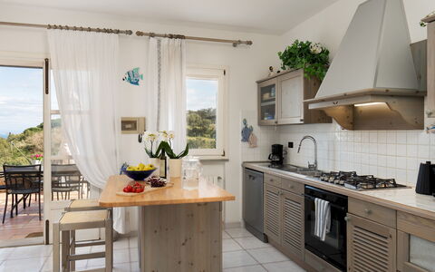 Villa Perelle 8: Furniture, Kitchen, Kitchen Appliance, Interior Design, Countertop, Flooring, Wood, Major Appliance, Cabinetry, Floor