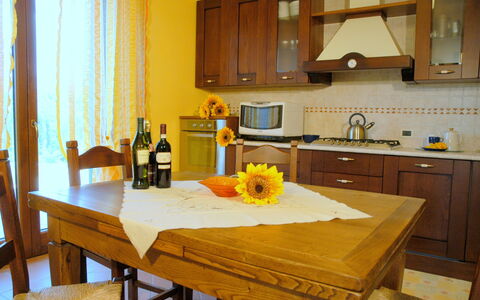 Villa Saida: Countertop, Room, Furniture, Property, Kitchen, Yellow, Interior Design, Floor, Cabinetry, Building