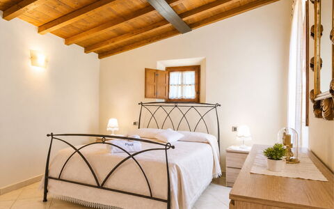 Pieve di Sant Ippolito: Furniture, Interior Design, Bed, Ceiling, Flooring, Bedroom, Floor, Bed Frame, Home, Room