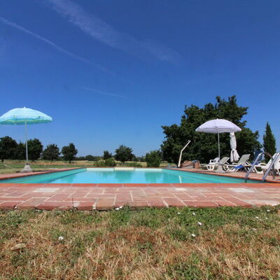 Il Viaggiolo: Sky, Plant, Swimming Pool, Cloud, Tree, Water, Building, Shade, Arecales, Land Lot
