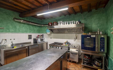 Torre di Vignale: Kitchen, Countertop, Kitchen Appliance, Interior Design, Flooring, Ceiling, Lighting, Furniture, Major Appliance, Kitchen Stove