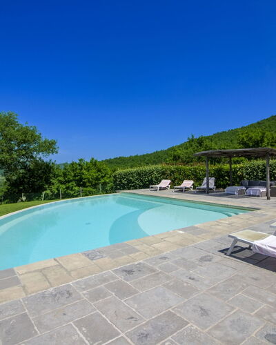 Torre di Vignale: Hill, Swimming Pool, Mountain Range, Outdoor Furniture, Eco Hotel, Flagstone, Resort, Ridge, Landscaping, Tropics