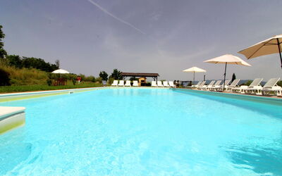 Podere Marcigliano: Water, Sky, Swimming Pool, Plant, Azure, Umbrella, Cloud, Rectangle, Tree, House