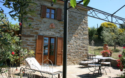 La Casina del Bosco: Plant, Building, Furniture, Property, Table, Window, Chair, Shade, Cottage, Outdoor Furniture