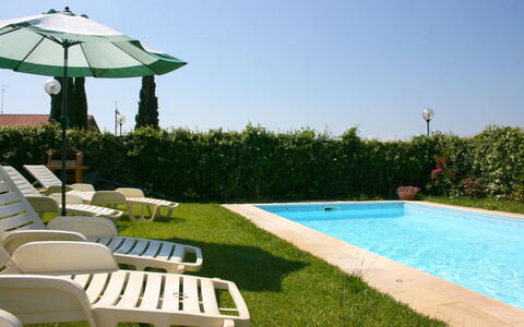 Casa Clementina: Water, Plant, Property, Sky, Green, Shade, Outdoor Furniture, Grass, Swimming Pool, Chair