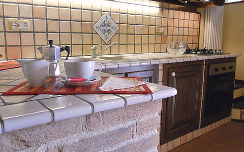 Casa Stefy: Countertop, Kitchen, Room, Tile, Property, Furniture, Cabinetry, Floor, Interior Design, Flooring